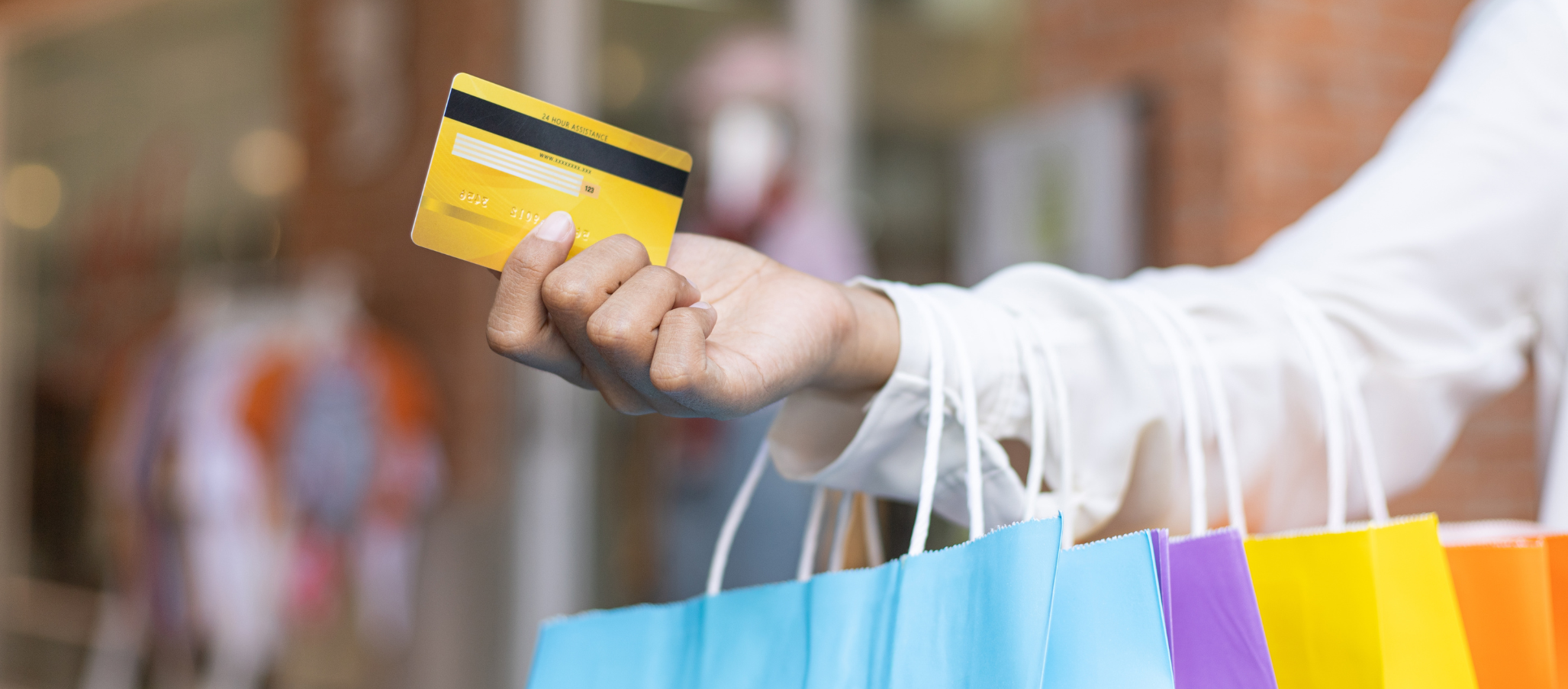 Shopping bags and credit card, lead picture for Pimento Thought Paper How to Ride Out the Recession Storm